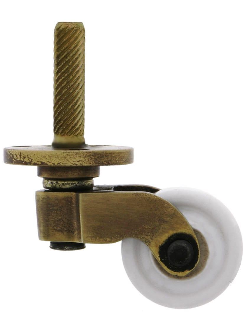 Casters |   Solid Brass Stem-and-Plate Caster with Porcelain Wheel in Antique-by-Hand Casters Casters